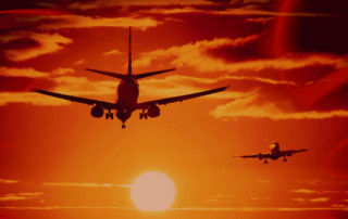 aircraft landing in sunset